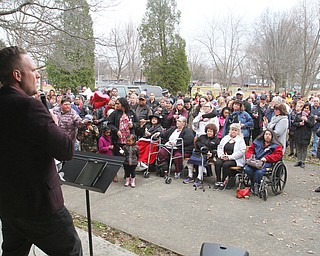 William D. Lewis The Vindicator  Chris Russo of Victory Christian Assembly church speaks during a vigil 3-24-19 at Roosevelt Parl in Campbell for a father and son who were killed in a car crash. More than 200 people attended the event.