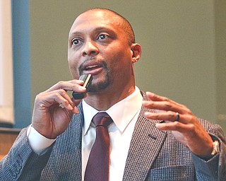 Eddie George, former Ohio State University running back, Heisman Trophy winner and longtime National Football League running back with the Tennessee Titans, meets with Youngstown State University faculty at the Williamson School of Business before his talk Tuesday at the YSU Thomas Colloquium at Stambaugh Auditorium.