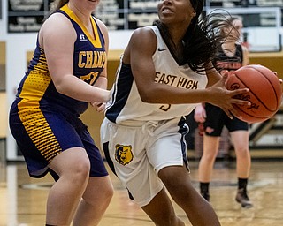 DIANNA OATRIDGE | THE VINDICATOR  Youngtown East's Deja Monroe (right) looks to drive to the hoop as Champion's Abby White (left) defends during the Frank Bubba All-Star Classic in Warren on Tuesday.