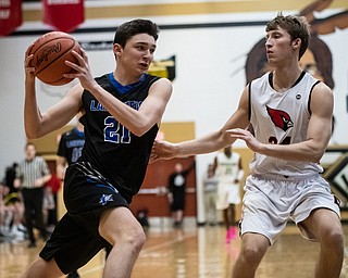 DIANNA OATRIDGE | THE VINDICATOR  Lakeview's Jeff Remmick (21) drives to the hoop against Canfield's Kyle Gamble (24) during the Frank Bubba All-Star Classic in Warren on Tuesday.