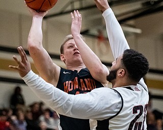 DIANNA OATRIDGE | THE VINDICATOR  West Howland's Nathan Barrett (left) shoots over Campbell's Raysean Hicks (23) during the Frank Bubba All-Star Classic in Warren on Tuesday.