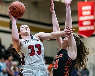 DIANNA OATRIDGE | THE VINDICATOR  Austintown Fitch's Sabria Hunter (33) shoots as Howland's Kayla Clark (40) defends during the Frank Bubba All-Star Classic in Warren on Tuesday.
