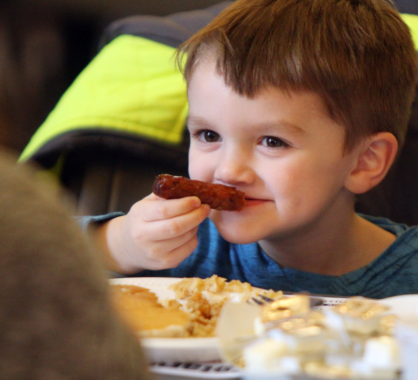William D. Lewis The Vindicator  Christopher Kaiser 4, of Butler, PA  chows down during pancake event in Boardman Park 3-24-19. He was visiting family in the area.