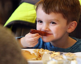 William D. Lewis The Vindicator  Christopher Kaiser 4, of Butler, PA  chows down during pancake event in Boardman Park 3-24-19. He was visiting family in the area.