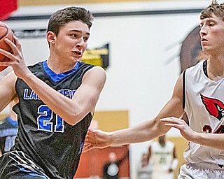 Jeff Remmick, left of Lakeview High School, drives to the basket against Kyle Gamble of Canfield High School during action at the annual Frank Bubba All-Star Classic in Warren. The Mahoning County boys and girls teams swept the Trumbull County teams Tuesday.