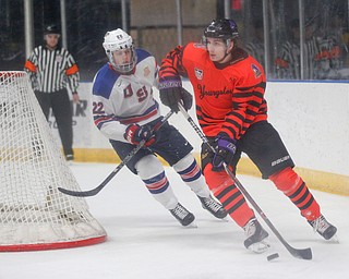 Phantoms' Matthew DeMelis tries to keep the puck from USA Hockey's National Team Development Program's Owen Lindmark during their school day game on Wednesday. EMILY MATTHEWS | THE VINDICATOR