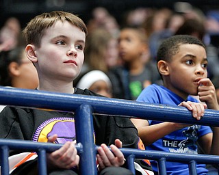 Patrick Rothrauff, 9, left, and Emmitt Nevels, 8, both students at the Lewis Center, watch the Phantoms take on USA Hockey's National Team Development Program on Wednesday. EMILY MATTHEWS | THE VINDICATOR