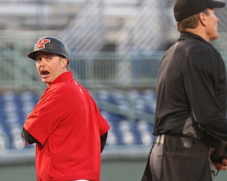 William D. Lewis The Vindicator  YSU ciach Dan Bertolini dispute a call with the home plate ump during 3-27-19 win over Pitt.