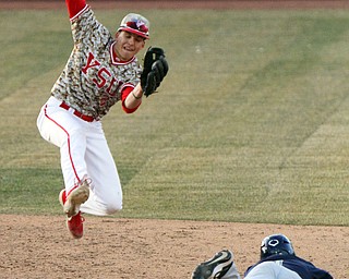 William D. Lewis The Vindicator  YSU's Phillip Glasser(2) makes a leaping catch to put Pitt's Sky Duff out at 2nd during 3-27-19 game.