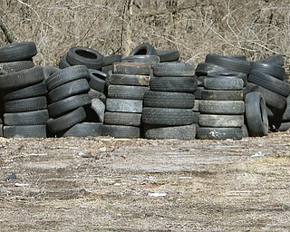 Some of the many tires taken from vacant Campbell homes. City officials are trying to find ways to stop the illegal tire dumping.