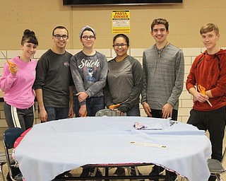 Neighbors | Abby Slanker.Canfield High School students, from left, Theresa Wasylychyn, Dominic DeRamo, Mariah Cashbaugh, Nicole El-Hayek, Ethan Morrison and David Schmidt made no-sew blankets as part of DeRamo’s National Honor Society community service project on Feb. 22.