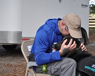 Neighbors | Submitted.Austintown resident Harvey met with his new service dog Rosa in Florida as part of the Healing Heros project funded by Armstrong.