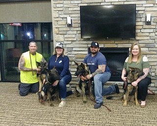 Neighbors | Submitted.Four veternas traveled to Florida to meet with their trained service dogs. Pictured, from left, are Harvey and his dog Rosa, Lisa and Yogi, Bryan and Fahrny and Samara and Angel.