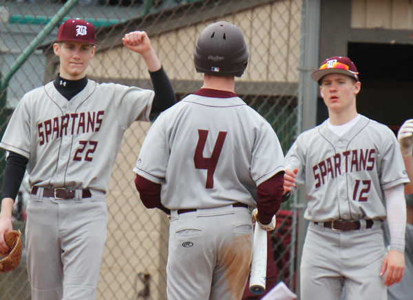 William D. Lewis The Vindicator Boardman's  Mike Fetsko(4)) gets congrats fMason Smith(22) and Nate Flemming (12)during 3-29-19 win over Ursuline at Cene.