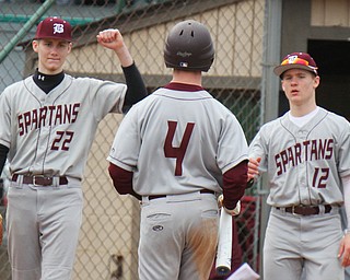 William D. Lewis The Vindicator Boardman's  Mike Fetsko(4)) gets congrats fMason Smith(22) and Nate Flemming (12)during 3-29-19 win over Ursuline at Cene.