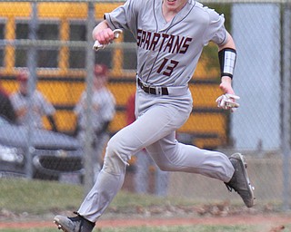 William D. Lewis The Vindicator Boardman Connor Miller(13) heads towards home to score during 3-29-19 win over Ursuline at Cene.