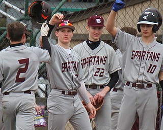 William D. Lewis The Vindicator Boardman's Travis Harvey(2) gets conrgrats from Jason Triveri(7) Mason smith(22) and Ty Ventresco(10) after scoring during 3-29-19 win over Ursuline at Cene.