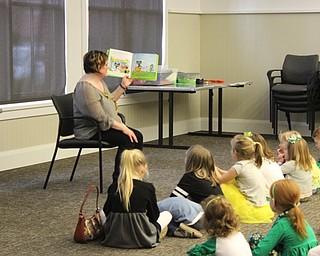 Neighbors | Abby Slanker.Amanda Kollar, Canfield library youth librarian, read “Pete the Cat - The Great Leprechaun Chase” during the library’s St. Patrick’s Day Shenanigans story time on March 16.