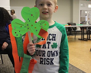 Neighbors | Abby Slanker.Elliott Oleksa showed off his shamrock craft at the Canfield library’s St. Patrick’s Day Shenanigans story time on March 16.