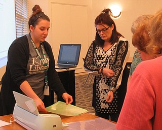 Neighbors | Jessica Harker.Librarian Renee Beverly walked community members through the various tools that go along with a Cricut machine March 21 at the Austintown library.