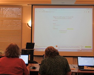 Neighbors | Jessica Harker.Community members gathered at the Austintown library March 21 to learn the basics of the Cricut machine, even making their own log in to the online program.