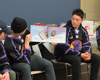Neighbors | Jessica Harker.Phantoms hockey player Aiden Galligher read "I'm Cool" to children gathered at the Boardman library March 19.