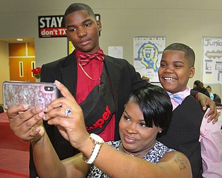 William D. Lewis The Vindicator Ieshia Moore and her sons Marquan Robinson, 12,  and Isaiah Moore, 10, take a selfie during Mom and son event at East HS 3-29-19.