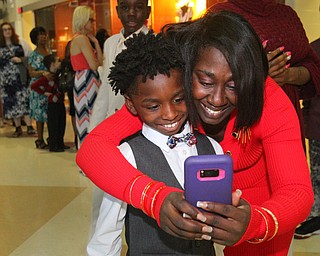 William D. Lewis The VindicatorKelly Napier and her son Amillione Bell, 9,  take a selfie during Mom and son event at East HS 3-29-19.
