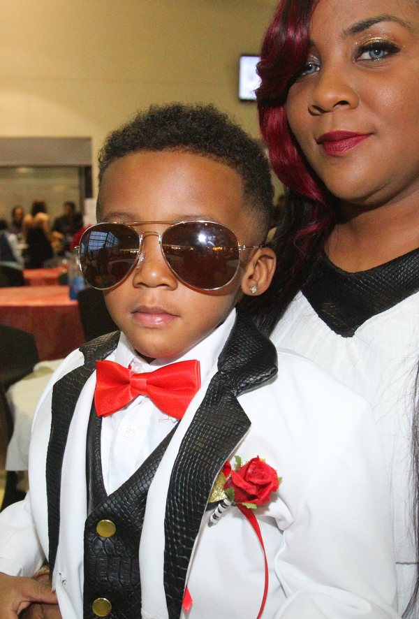 William D. Lewis The Vindicator Neshaya Council shares a moment with her son Kylan Miller, 4, during Mom and son event at East HS 3-29-19.
