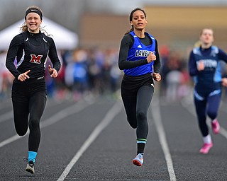 MINERAL RIDGE, OHIO - MARCH 30, 2019: Lakeview's Danaysha Mauzy and Matthews' Carlie Pratt sprint to the finish line during a preliminary heat of the girls 100 yard dash, Saturday morning during the Joe Lane Invitational at Mineral Ridge High School. DAVID DERMER | THE VINDICATOR