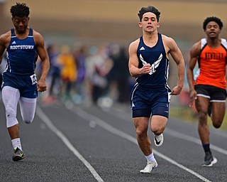 MINERAL RIDGE, OHIO - MARCH 30, 2019: McDonald's Dominic Schadl runs ahead of Rootstown's Dayvon Ferrell and Newbury's Xander Harrison during a preliminary heat of the girls 100 yard dash, Saturday morning during the Joe Lane Invitational at Mineral Ridge High School. DAVID DERMER | THE VINDICATOR