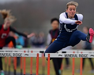 MINERAL RIDGE, OHIO - MARCH 30, 2019: McDonald's Naomi Domitrovich runs during a preliminary heat of the girls 100 yard hurdles, Saturday morning during the Joe Lane Invitational at Mineral Ridge High School. DAVID DERMER | THE VINDICATOR