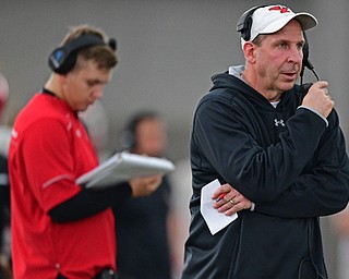 YOUNGSTOWN, OHIO - MARCH 30, 2019: Youngstown State head coach Bo Pelini watches from behind the play during Saturday afternoon's spring scrimmage at the Watson and Tressel Training Facility. DAVID DERMER | THE VINDICATOR