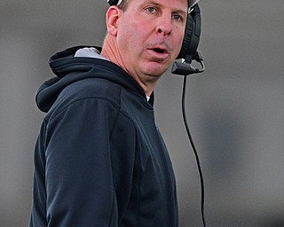 YOUNGSTOWN, OHIO - MARCH 30, 2019: Youngstown State head coach Bo Pelini watches from behind the play during Saturday afternoon's spring scrimmage at the Watson and Tressel Training Facility. DAVID DERMER | THE VINDICATOR