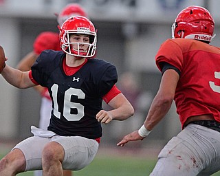 YOUNGSTOWN, OHIO - MARCH 30, 2019: Youngstown State's Mitch Davidson looks to throw while being pressured by Antoine Cook during Saturday afternoon's spring scrimmage at the Watson and Tressel Training Facility. DAVID DERMER | THE VINDICATOR