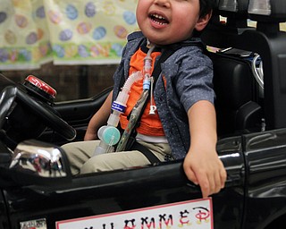 Mohammed Yasin (2) of Austintown smiles as he tests the controls of his new jeep during the Go Daddy Go event at the MCCTC in Canfield on Saturday morning.   Dustin Livesay  |  The Vindicator  3/30/19  MCCTC