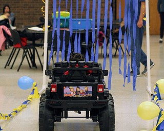 Kaige Hall-Ward (1) of Younhstown rides through an obstacle course in his newly made jeep that allows his parents to control the car from a remote control to allow him to drive during the Go Daddy Go event at the MCCTC in Canfield on Saturday morning.   Dustin Livesay  |  The Vindicator  3/30/19  MCCTC