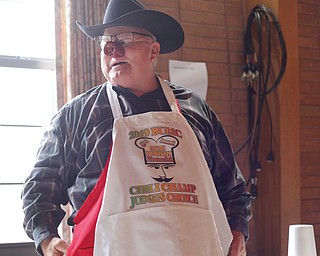 Dale Hawkins, of Boardman, stands with his apron he won for having the Judges Choice first place chili at the eighth annual Chili Cookoff at Boardman United Methodist Church on Sunday. EMILY MATTHEWS | THE VINDICATOR