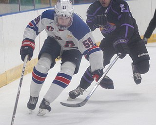 Phantoms' Aiden Gallacher reaches to try to get the puck from Team USA's Ty Smilanic during their game on Sunday. EMILY MATTHEWS | THE VINDICATOR