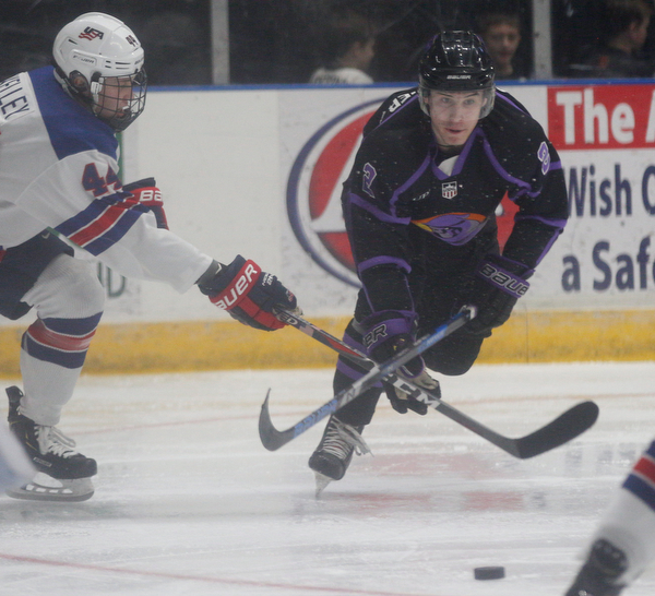 Phantoms' Aiden Gallacher tries to keep the puck from Team USA's Connor Kelley during their game on Sunday. EMILY MATTHEWS | THE VINDICATOR