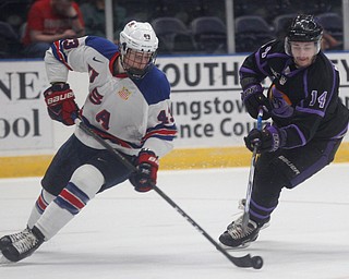 Phantoms' Dalton Messina tries to get the puck from Team USA's Tyler Kleven during their game on Sunday. EMILY MATTHEWS | THE VINDICATOR