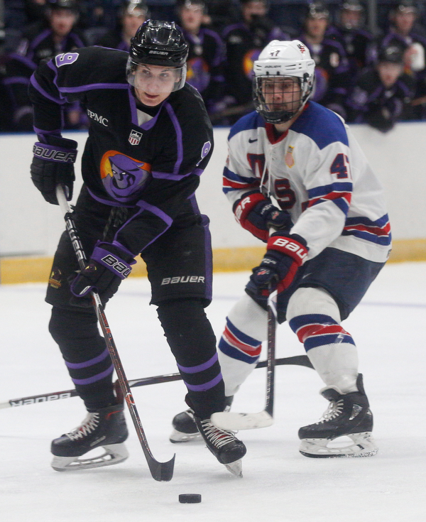 Phantoms' Matt DeMelis tries to keep the puck from Team USA's Thomas Bordeleau during their game on Sunday. EMILY MATTHEWS | THE VINDICATOR