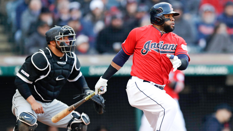 Cleveland Indians' Carlos Santana, right, watches his RBI-single off Chicago White Sox starting pitcher Ivan Nova in the sixth inning of Monday’s game in Cleveland. Jose Ramirez scored on the play. White Sox catcher Welington Castillo, left, also watches the hit.
