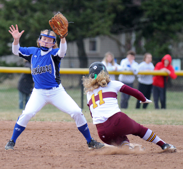 William D. Lewis the Vindicator  South Range's Bree Kohler(11) is safe at 2nd as Poland's Lauren Sienkiewicz(11) tries to make the tag during 4-2-19 game at South Range.