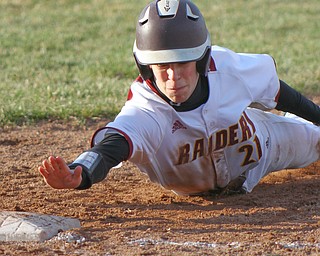 William D. Lewis the Vindicator  Poland's Jeremyu Castro (21) dives back to first in a pick off attempt during 4-2-19 game at South Range.