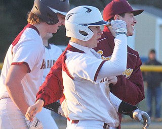 William D. Lewis the Vindicator South Rqnge's Like Blasko, center, celebrtes after scoring winning run in game with Poland.