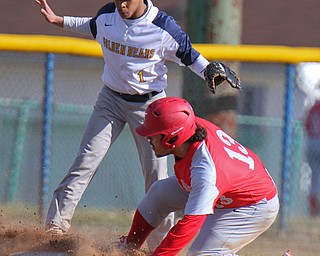 William D. Lewis The Vindicator Chaney's Michael Doucette (13)  is safe at 3rd as East's (DanteHuirst 1) waits for the throw during 4-3-19 game with Chaney at Pemberton.