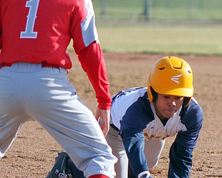 William D. Lewis The VindicatorEast's Edliam Oneill(2) dives back to first as Chaney's Juan Agotto(1) waits for the throw during 4-3-19 game  at Pemberton.