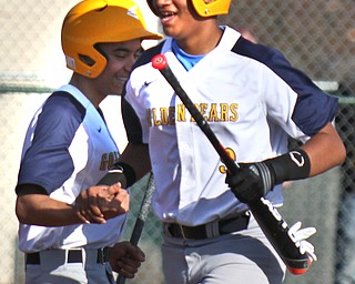 William D. Lewis The Vindicator East's Carlos Marrero(9) gets congrats from Jeremiah Antonetty(4)during 1rst inning of 4-3-19 game with Chaney at Pemberton.