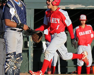 William D. Lewis The Vindicator Chaney's  Juan Agotto(1) reacts after scoring during 4-3-19 game with East at Pemberton. East catcher looks on.